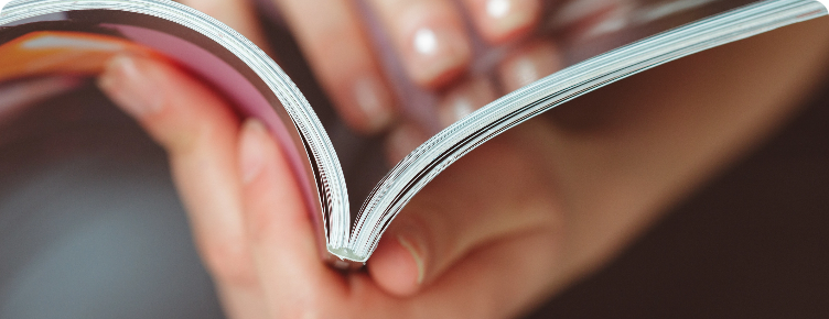 An image of someone holding a book